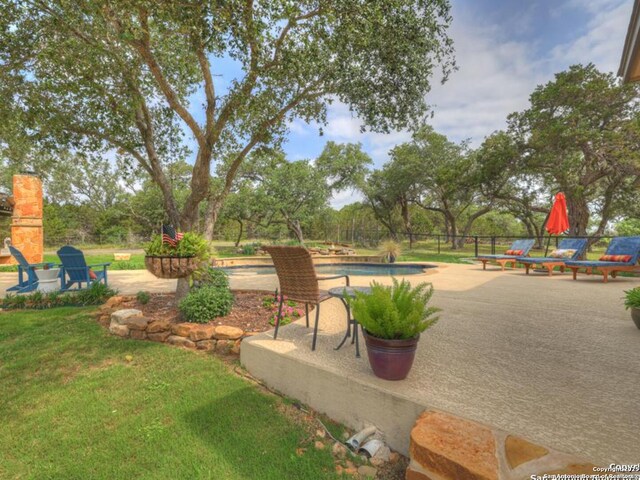 1236 Primrose Path, Canyon Lake, TX 78133 - view of yard with an outdoor pool and a patio