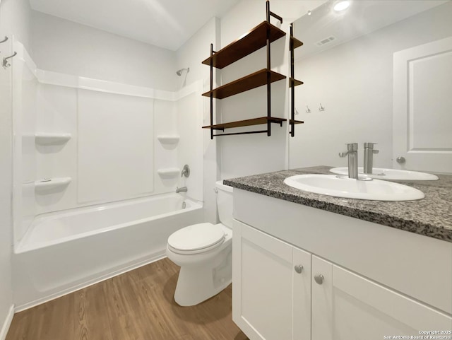5336 Forbs, Bulverde, TX 78163 - full bathroom with vanity, washtub / shower combination, wood finished floors, visible vents, and toilet
