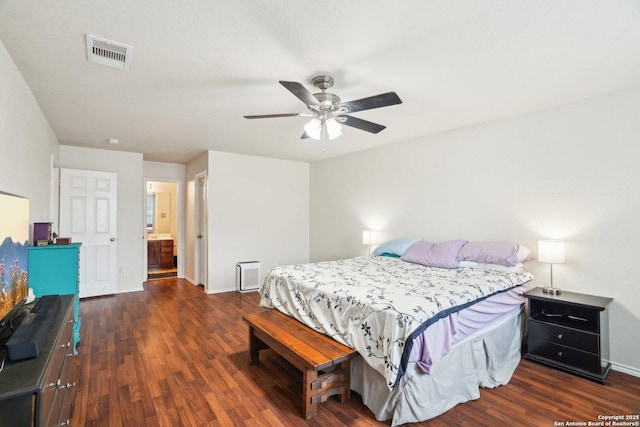 bedroom featuring visible vents, baseboards, a ceiling fan, and wood finished floors