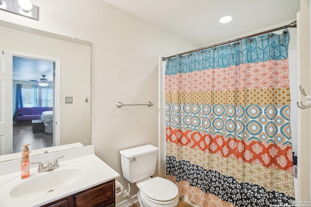 full bathroom featuring ensuite bath, vanity, curtained shower, and toilet