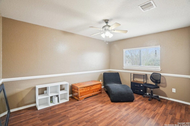 sitting room with visible vents, baseboards, a ceiling fan, and wood finished floors