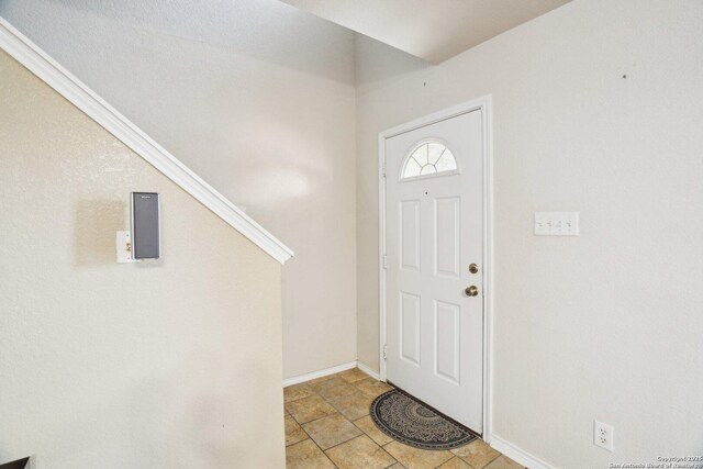 entryway featuring baseboards