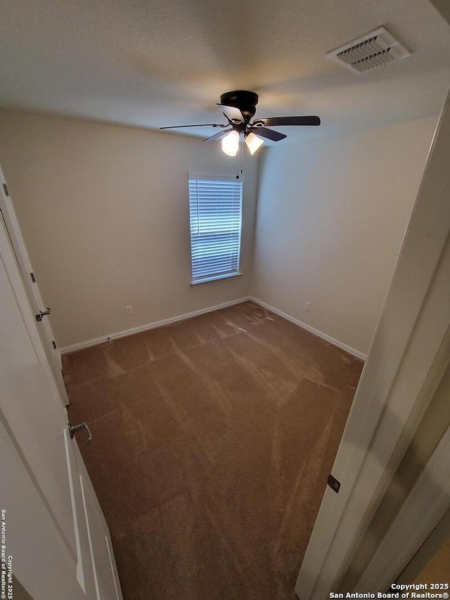 1976 Cowan Dr, New Braunfels, TX 78132 - carpeted empty room with a ceiling fan, visible vents, and baseboards