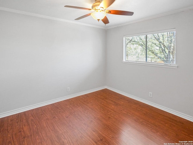 empty room with baseboards, wood finished floors, and ceiling fan
