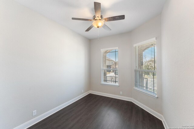 21950 Akin Byu, San Antonio, TX 78261 - unfurnished room featuring baseboards, a ceiling fan, and dark wood-style flooring