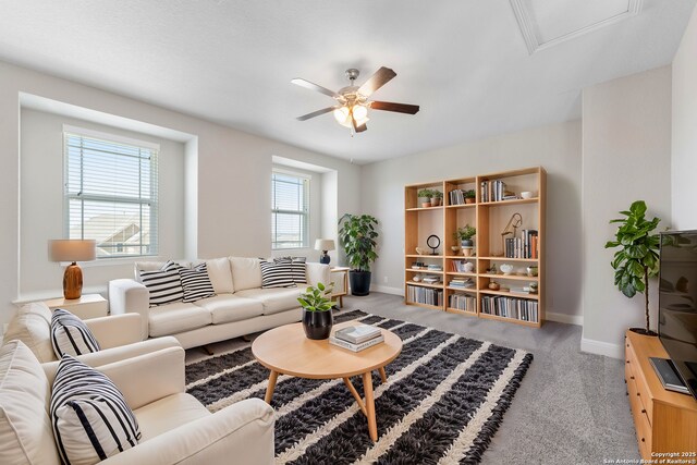 21950 Akin Byu, San Antonio, TX 78261 - living room featuring baseboards, carpet, and ceiling fan