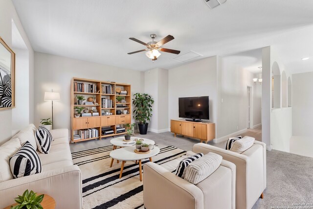 21950 Akin Byu, San Antonio, TX 78261 - living room featuring carpet flooring, baseboards, visible vents, and ceiling fan