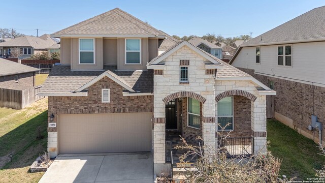 21950 Akin Byu, San Antonio, TX 78261 - view of front of home featuring brick siding, driveway, and a shingled roof