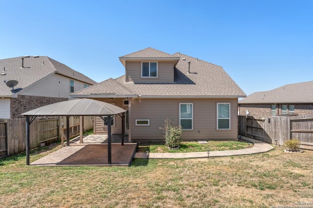 21950 Akin Byu, San Antonio, TX 78261 - rear view of house featuring a gazebo, a yard, a fenced backyard, and a patio area