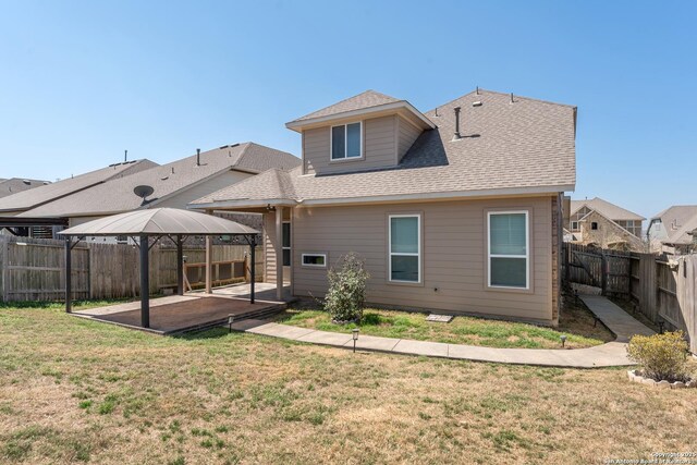 21950 Akin Byu, San Antonio, TX 78261 - rear view of property with a patio, a fenced backyard, a gazebo, a yard, and roof with shingles
