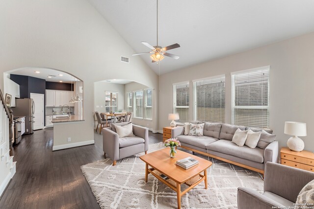 21950 Akin Byu, San Antonio, TX 78261 - living room with visible vents, high vaulted ceiling, a ceiling fan, dark wood finished floors, and arched walkways