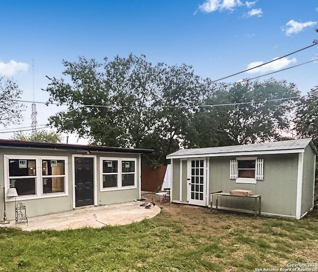 231 Cicero, San Antonio, TX 78218 - rear view of house featuring a yard, an outdoor structure, stucco siding, and a patio area
