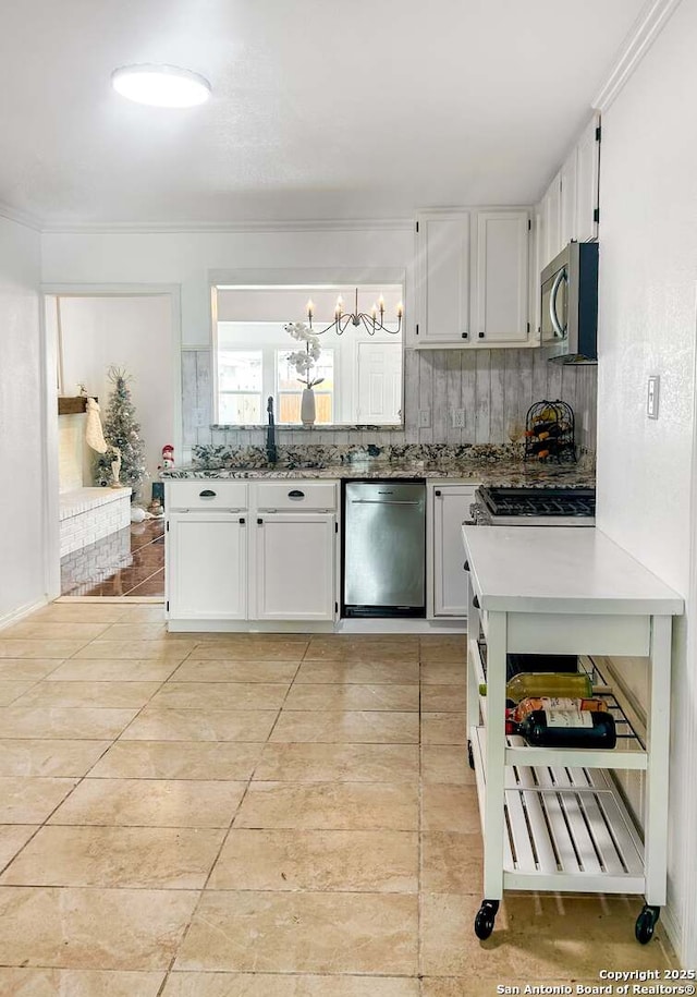 231 Cicero, San Antonio, TX 78218 - kitchen featuring appliances with stainless steel finishes, a sink, a chandelier, and white cabinets