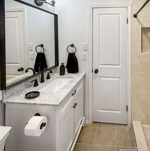 231 Cicero, San Antonio, TX 78218 - bathroom with tile patterned flooring and vanity