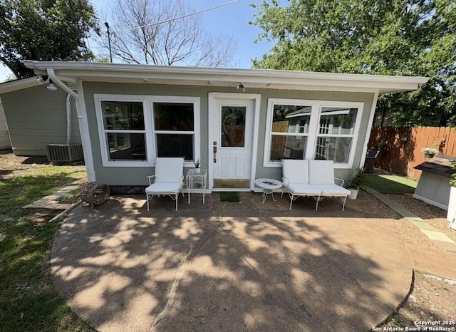 231 Cicero, San Antonio, TX 78218 - back of house featuring fence, a patio, and central AC unit