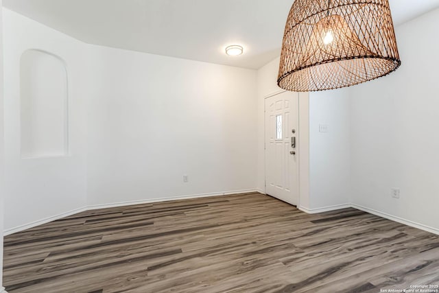 7519 Paraiso Hvn, Boerne, TX 78015 - entryway with baseboards, wood finished floors, and a chandelier
