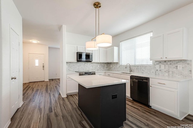 7519 Paraiso Hvn, Boerne, TX 78015 - kitchen with backsplash, dark wood finished floors, appliances with stainless steel finishes, white cabinetry, and a sink