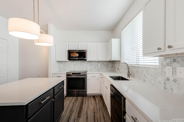 7519 Paraiso Hvn, Boerne, TX 78015 - kitchen with a sink, appliances with stainless steel finishes, dark cabinetry, and white cabinets