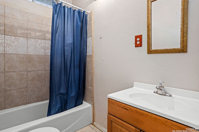 full bath featuring vanity and shower / tub combo