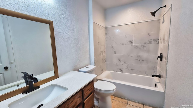 full bath with tile patterned flooring, toilet, bathtub / shower combination, a textured wall, and vanity