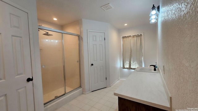 full bathroom with visible vents, recessed lighting, a stall shower, tile patterned floors, and vanity