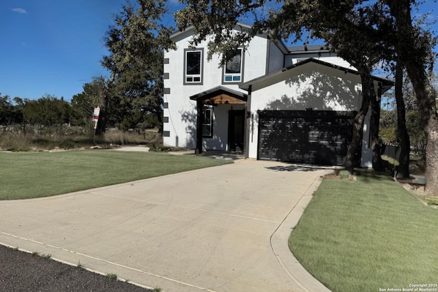 view of front facade featuring concrete driveway, stucco siding, a front lawn, and an attached garage