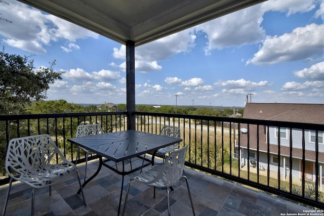 balcony featuring outdoor dining area