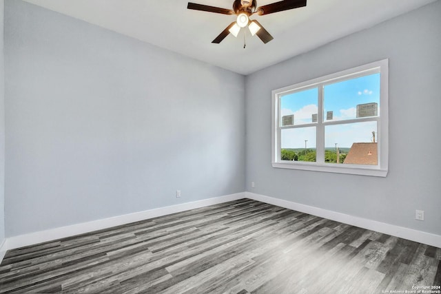 unfurnished room with wood finished floors, baseboards, and ceiling fan