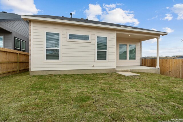206 Buttercup Aly, San Antonio, TX 78253 - rear view of house featuring a patio, a lawn, and fence