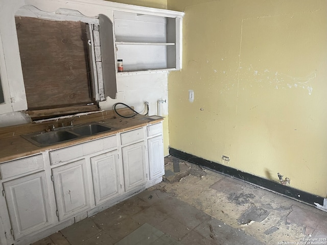 108 Ripford, San Antonio, TX 78204 - kitchen featuring a sink and baseboards