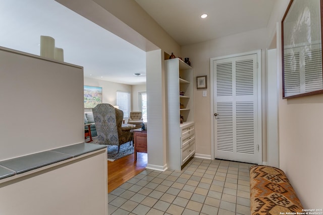 foyer entrance featuring light tile patterned floors and recessed lighting
