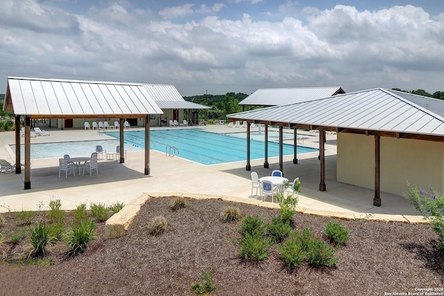 pool with a patio