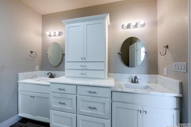 301 Honeysuckle Ln, Vernia, TX 78121 - full bath with a sink, baseboards, and two vanities