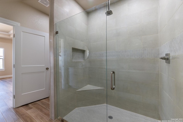 301 Honeysuckle Ln, Vernia, TX 78121 - full bathroom featuring visible vents, a stall shower, and wood finished floors