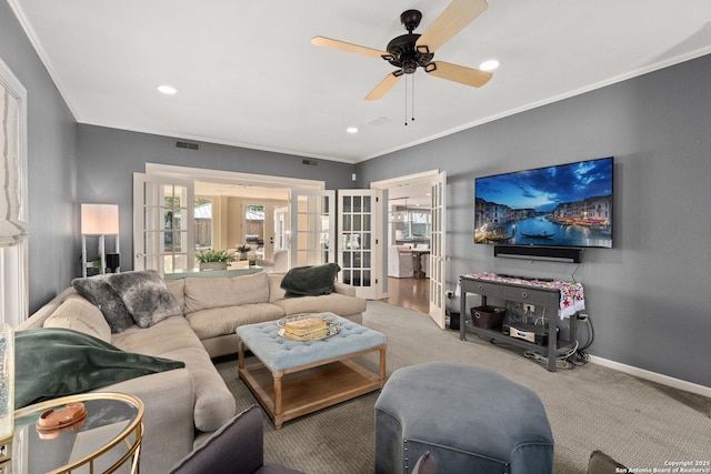 carpeted living room featuring ornamental molding, recessed lighting, french doors, baseboards, and ceiling fan