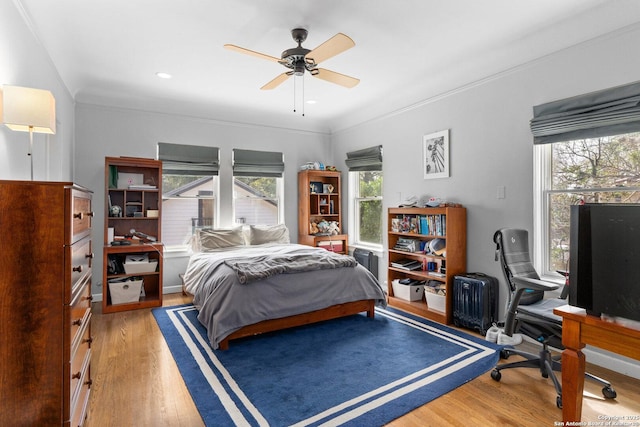 bedroom featuring crown molding, recessed lighting, light wood-type flooring, and ceiling fan