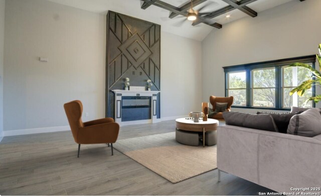 116 Hidden Ranch Ct, Floresville, TX 78114 - living room with wood finished floors, ceiling fan, beamed ceiling, baseboards, and high vaulted ceiling