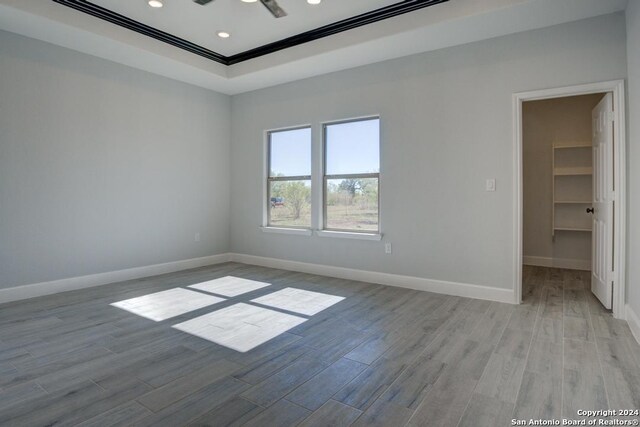 116 Hidden Ranch Ct, Floresville, TX 78114 - unfurnished room featuring light wood-style floors, baseboards, crown molding, and recessed lighting