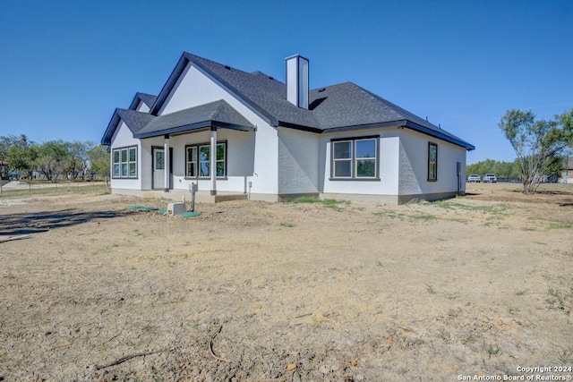 116 Hidden Ranch Ct, Floresville, TX 78114 - back of house with roof with shingles