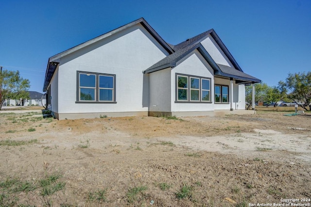 116 Hidden Ranch Ct, Floresville, TX 78114 - rear view of house with stucco siding