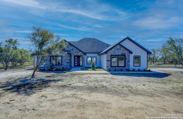 116 Hidden Ranch Ct, Floresville, TX 78114 - view of front of property featuring stone siding and board and batten siding