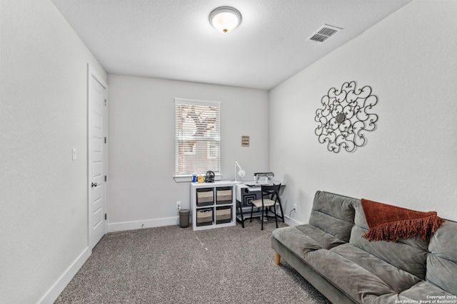 carpeted home office featuring baseboards and visible vents