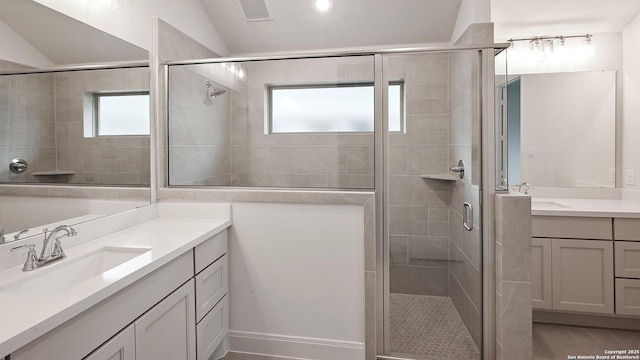 355 Alpine Lks, New Braunfels, TX 78130 - bathroom with a shower stall, vanity, plenty of natural light, and lofted ceiling