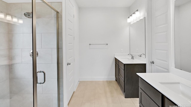 4971 Park Mnr, Schertz, TX 78124 - full bath with a stall shower, two vanities, baseboards, and tile patterned floors