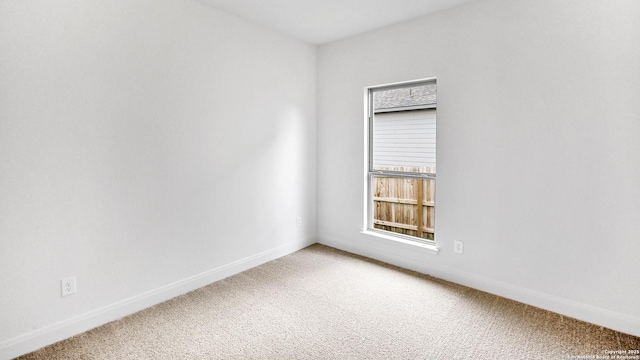 4971 Park Mnr, Schertz, TX 78124 - spare room featuring light carpet and baseboards