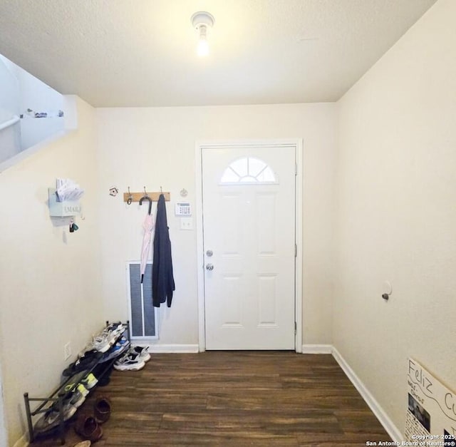 9991 Hawksbill Peak, San Antonio, TX 78245 - foyer entrance featuring visible vents, baseboards, and dark wood-type flooring