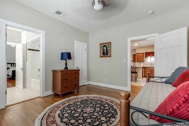 2106 W Gramercy Pl, San Antonio, TX 78201 - living area with visible vents, baseboards, light wood-style flooring, and a ceiling fan