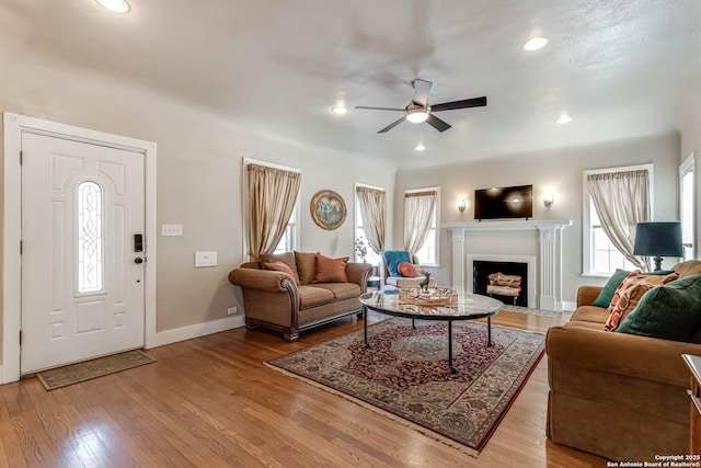 2106 W Gramercy Pl, San Antonio, TX 78201 - living room with baseboards, a fireplace with flush hearth, recessed lighting, wood finished floors, and a ceiling fan