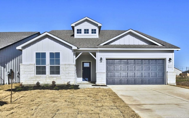 1514 Saddleback, New Braunfels, TX 78130 - view of front of house with board and batten siding, roof with shingles, a garage, and driveway