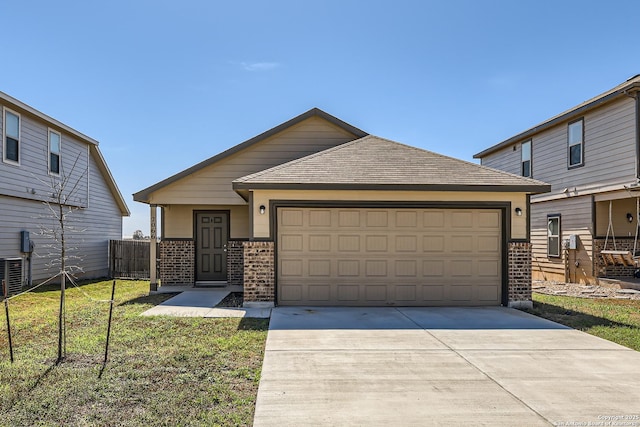2066 Chelsea, New Braunfels, TX 78130 - view of front of house featuring driveway, a shingled roof, a front yard, an attached garage, and brick siding